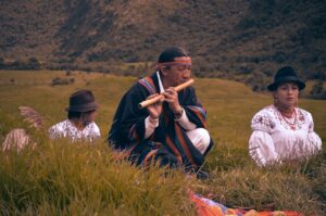 Indigenous man playing instrument