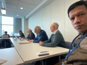 Meeting attendees sitting at table